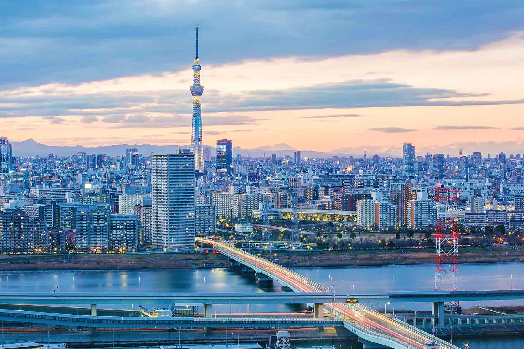 Japan Visa Tokyo Skytree tower and cityscape at twilight with river and bridges, Japan